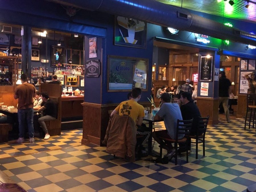 Customers at Water Street Tavern drinking at one of the designated tables as part of the social distancing protocol on Friday, Oct. 23, 2020.