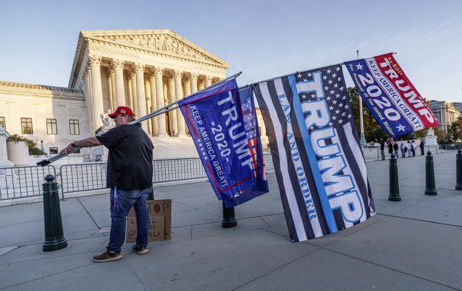 Scott Knuth of Woodbridge, Va., finishes his vigil outside the Supreme Court in support of President Donald Trump, in Washington, Friday afternoon, Nov. 6, 2020. (AP Photo/J. Scott Applewhite)