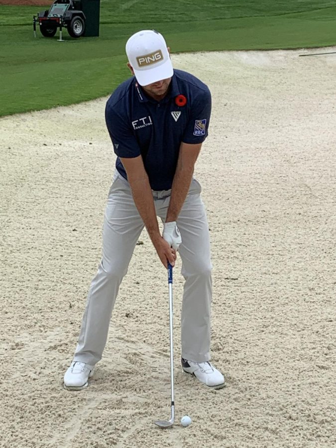 Corey Conners chipping out of a sand trap at Augusta National Golf Club in Augusta, Georgia. Conners was wearing a poppy pin in honor of Remembrance Day. Taken from Conners’ Twitter account (@coreconn). Nov. 11, 2020.