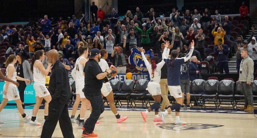 The Kent State women’s basketball team celebrates with the Kent State fans after winning 72-66 against Buffalo in a quarterfinal game at the Rocket Mortgage Field House in Cleveland on Wednesday, March 11, 2020. 