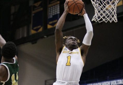 Mike Nuga (1) goes up for a dunk in Kent State’s win over Point Park University. Nuga would finish the game with 17 points. Dec. 2, 2020.