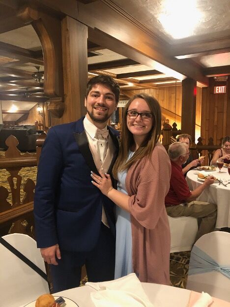 Miranda Harper, senior psychology major at Kent State, and her fiancé Josh Davis celebrate at a friend’s wedding a few weeks after they were engaged on July 3, 2020.