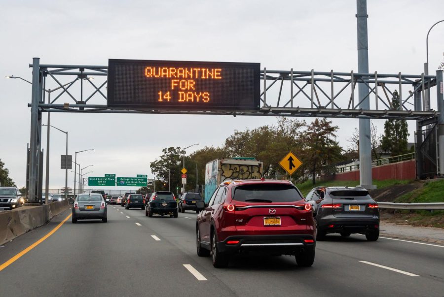 CDC will decrease coronavirus quarantine time from 14 to 7-10 days. This image shows a traffic sign reading, quarantine for 14 days above a road in Brooklyn on October 25, 2020 in New York City.