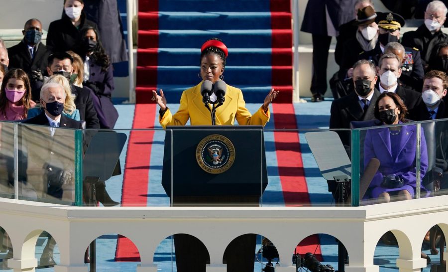 National youth poet laureate Amanda Gorman recites her inaugural poem during the 59th Presidential Inauguration at the U.S. Capitol in Washington, Wednesday, Jan. 20, 2021. Joe Biden became the 46th president of the United States on Jan. 20. (AP Photo/Patrick Semansky, Pool)