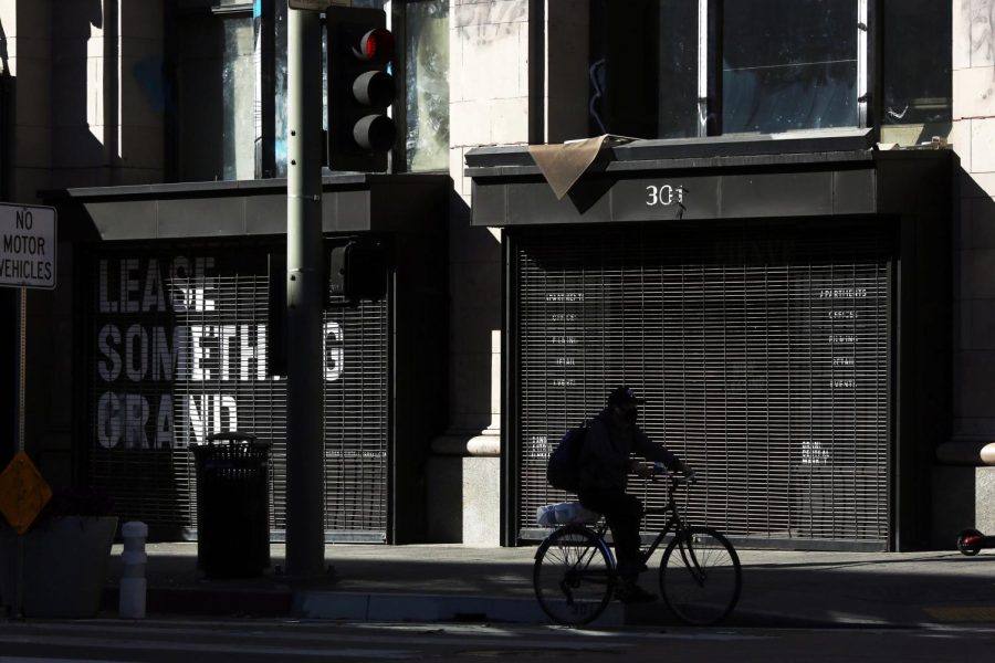 LOS ANGELES, CA - DECEMBER 29: A biker passes a store for lease in downtown on Tuesday, Dec. 29, 2020 in Los Angeles, CA. Gov. Gavin Newsom expects California to extend regional stay-at-home orders in two large swaths of the state. The stay-at-home order in the San Joaquin Valley and Southern California would have been eligible to expire as early as Monday, but with ICU capacity at 0% in both regions, the restrictions are set to be extended.(Dania Maxwell / Los Angeles Times via Getty Images)