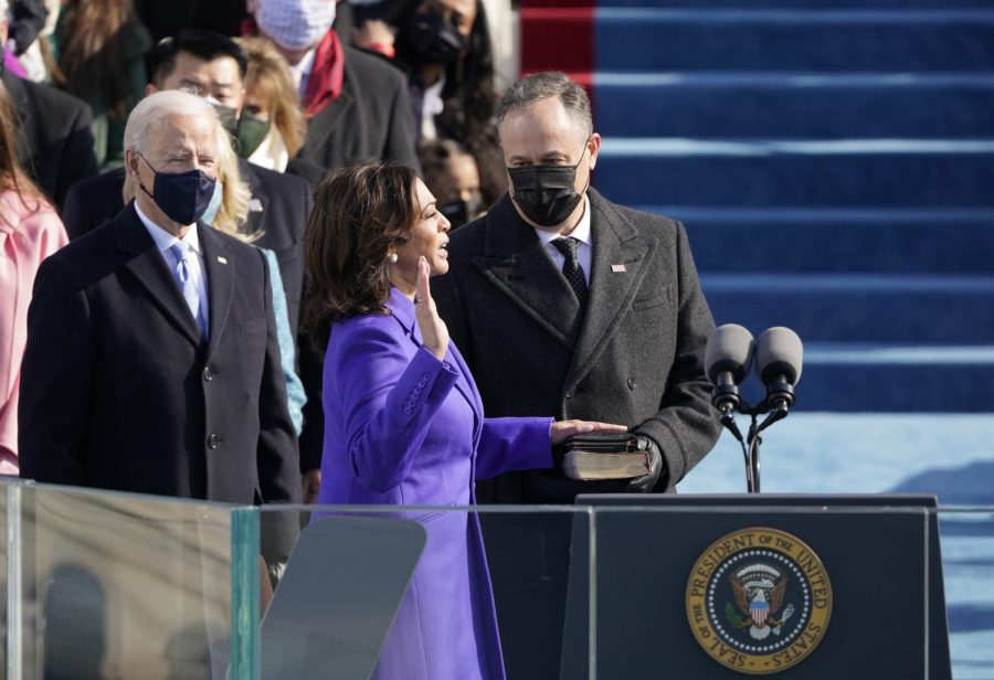 Kamala Harris is sworn in as vice president by Supreme Court Justice Sonia Sotomayor as her husband Doug Emhoff holds the Bible during the 59th Presidential Inauguration at the U.S. Capitol in Washington, Wednesday, Jan. 20, 2021. 