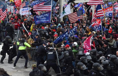 Trump supporters clash with police and security forces as they push barricades to storm the US Capitol in Washington D.C on January 6, 2021. Demonstrators breeched security and entered the Capitol as Congress debated the a 2020 presidential election Electoral Vote Certification.