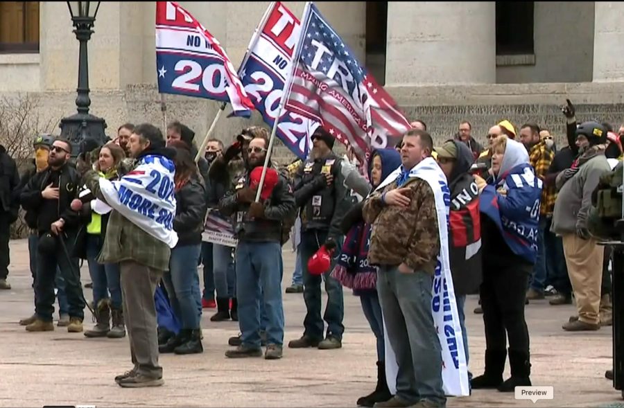 Supporters of President Donald Trump gather in front of the Ohio Statehouse in downtown Columbus on Jan. 6, 2021 to protest the certification of the election results in Washington D.C. Protesters there breached the Capital grounds and had to be cleared from the U.S. Senate chambers. 