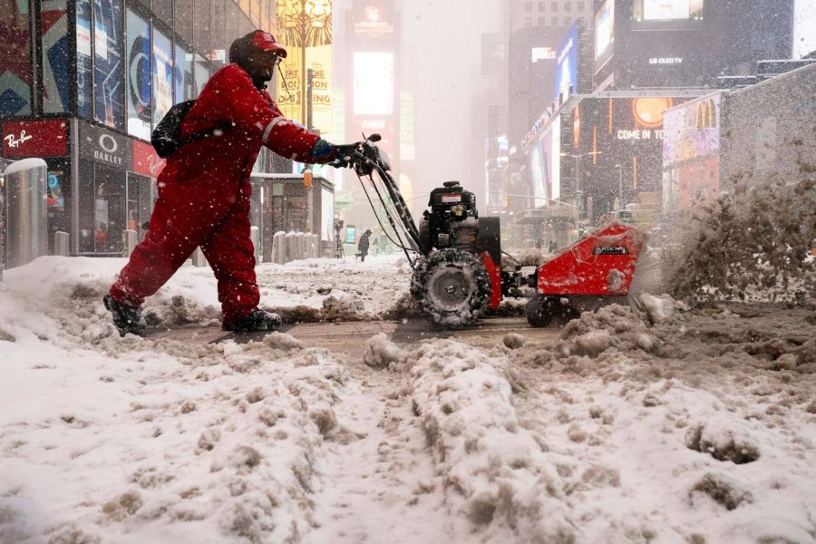 A+Times+Square+Alliance+worker+clears+sidewalks+of+snow+in+Times+Square%2C+Monday%2C+Feb.+1%2C+2021%2C+in+the+Manhattan+borough+of+New+York.+%28AP+Photo%2FJohn+Minchillo%29