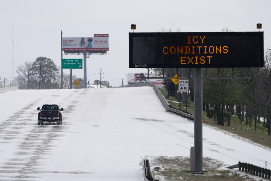 A+truck+drives+past+a+highway+sign+Monday%2C+Feb.+15%2C+2021%2C+in+Houston.+A+frigid+blast+of+winter+weather+across+the+U.S.+plunged+Texas+into+an+unusually+icy+emergency+Monday+that+knocked+out+power+to+more+than+2+million+people+and+shut+down+grocery+stores+and+dangerously+snowy+roads.+%28AP+Photo%2FDavid+J.+Phillip%29