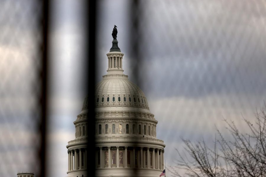WASHINGTON, DC - JANUARY 17: The U.S. Capitol dome is seen beyond a security fence on January 17, 2021 in Washington, DC. After last weeks riots at the U.S. Capitol Building, the FBI has warned of additional threats in the nations capital and in all 50 states. According to reports, as many as 25,000 National Guard soldiers will be guarding the city as preparations are made for the inauguration of Joe Biden as the 46th U.S. President. (Photo by Michael M. Santiago/Getty Images)