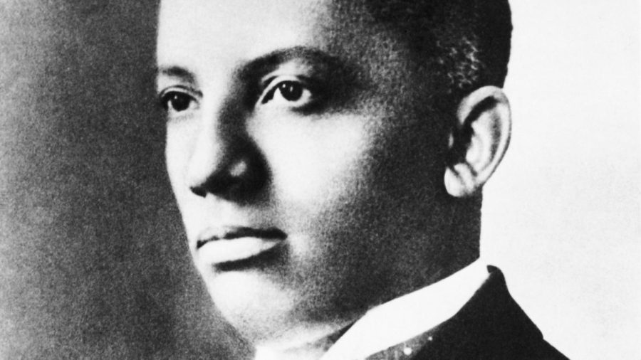 Carter Goodwin Woodson (1875-1950), African-American historian, is shown in a head and shoulders portrait.