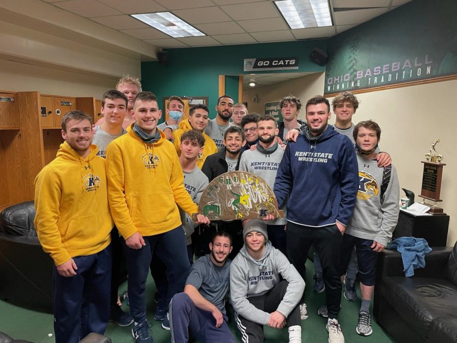 Wrestling team group photo posted to the Kent State Wrestling twitter account (@KentStWrestling). The team poses with the Grudge Match rivalry trophy that Kent State and Ohio University compete over after Kent won 22-10 in Athens. Feb. 7, 2021.