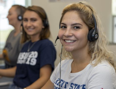 Victoria Leya (right) poses for a picture while speaking with alumni at the Kent State PhoneCenter in 2019. 