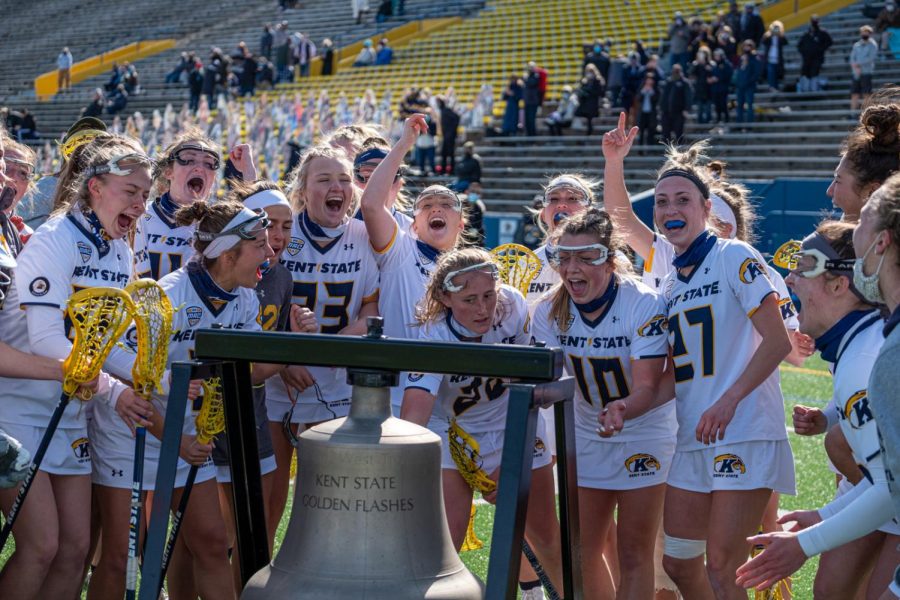The Kent State women’s lacrosse team celebrates its win in the first-ever women’s lacrosse iteration of the Wagon Wheel Rivalry against the University of Akron. KSU won 9-8 at home. March 13, 2021.