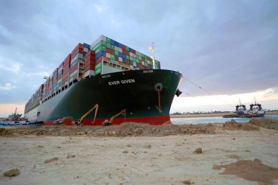 A handout photograph made available by the Suez Canal Authority, shows floatation work being carried out on the Ever Given container ship which ran aground in the Suez Canal, Egypt, 28 March 2021. The Ever Given, a large container ship ran aground in the Suez Canal on 23 March, blocking passage of other ships and causing a traffic jam for cargo vessels. The head of the Suez Canal Authority announced on 28 March that efforts for the floatation of the Ever Given are continuing. Its floatation is being carried out by 14 tugboats that are towing and pushing the grounding vessel, it has on 27 March moved by two inches and the authorities hope that the ship will move further after the water starts running underneath it. Suez Canal blocked as container ship runs aground, Egypt - 28 Mar 2021