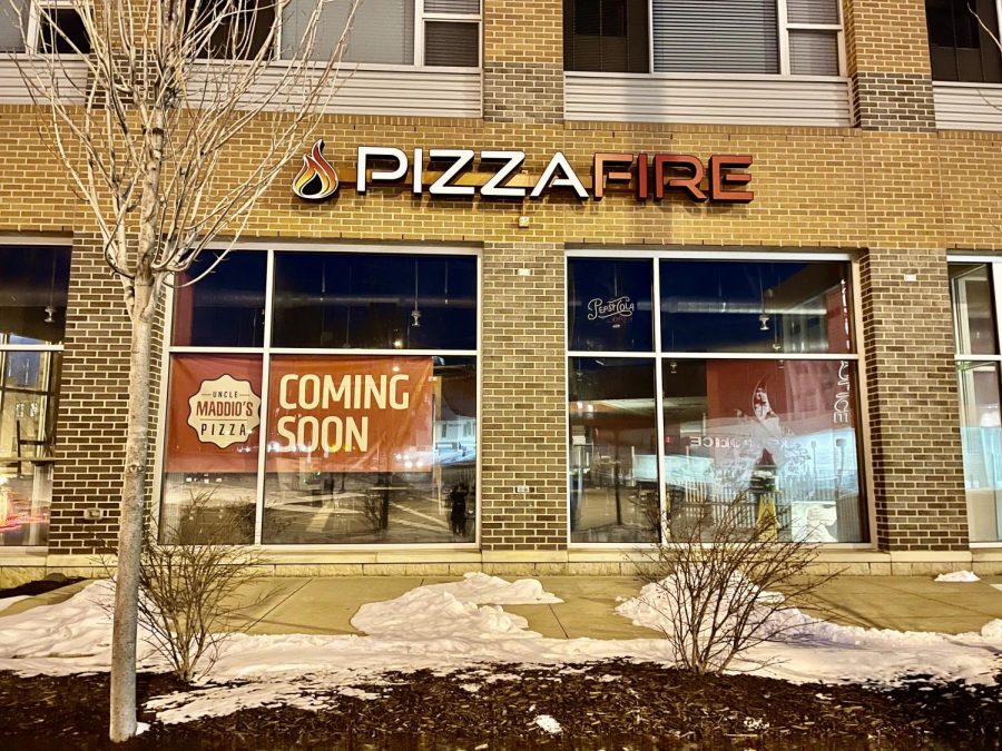 Uncle Maddio’s Pizza banners put up in windows of old Pizza Fire location.