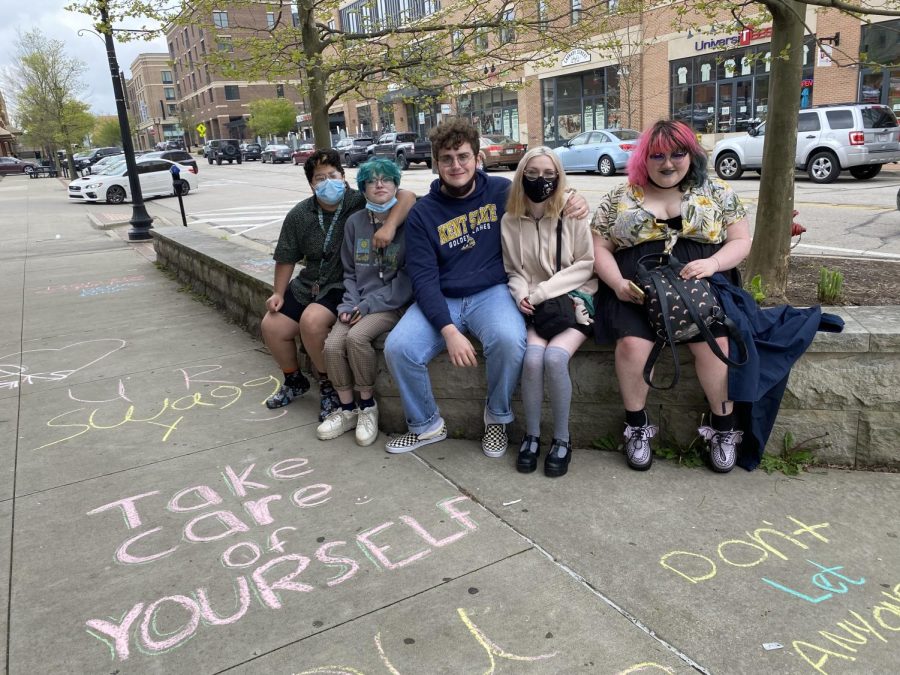 Students at Save Lives chalk walk. (From right to left) Maura Reali, SMFHS student; McKenna Dunn, SMFHS student; Gabriel Goding, Kent State psychology major; Madi Dunn, SMFHS student; and Rheagan Gabanyie, SMFHS student.