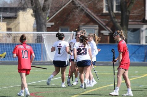 Detroit Mercy players celebrate a goal in their 24-12 rout of Youngstown State University on April 17, 2021.