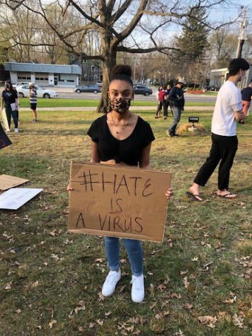 Aylah Mendenhall with her anti-hate inspired sign.