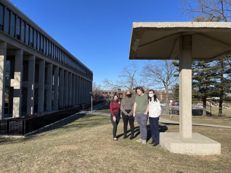 (Left to right) Kathleen Tran, Lindy Holmes, Jarrod Jones and Jordan Clagg pose beneath the Pagoda outside of Taylor Hall.