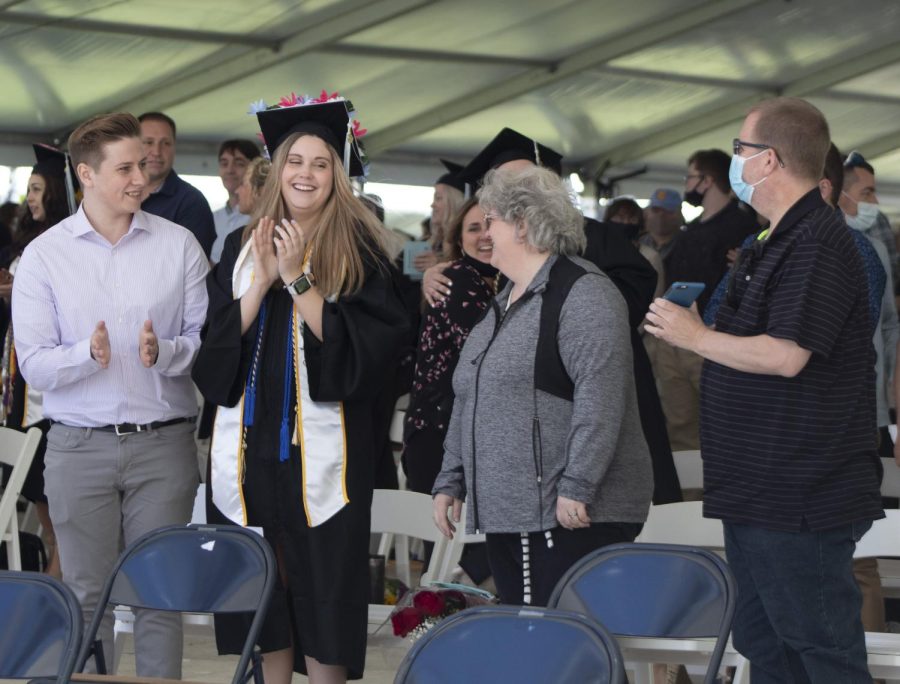 Family members and guests were encouraged to stand with their graduates and congratulate them before receiving their diplomas on May 13, 2021.