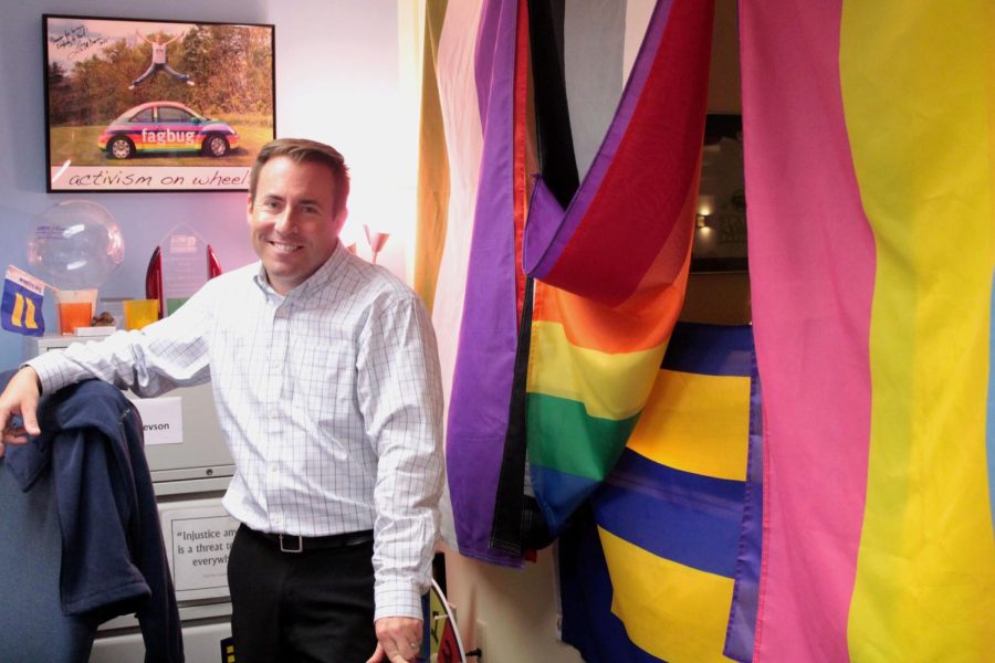 Ken+Ditlevson%2C+director+of+the+LGBTQ%2B+Center+stands+in+his+office.+THE+LGBTQ%2B+Center+offers+Safe+Space+Ally+training+in+order+to+create+an+inclusive+space+on+campus+for+all+people.