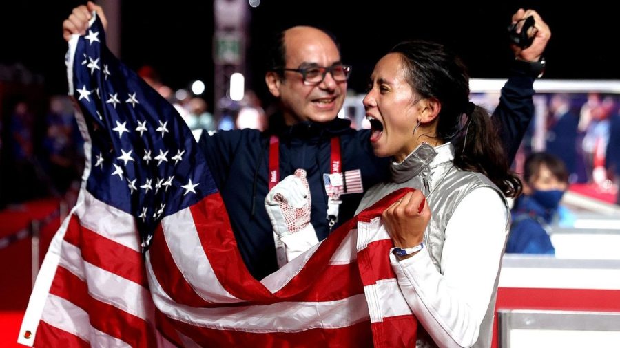 Lee+Kiefer+of+the+United+States+celebrates+with+her+coach+after+winning+gold+in+fencing+against+Inna+Deriglazova+of+the+Russia+Olympic+Committee+on+July+25.