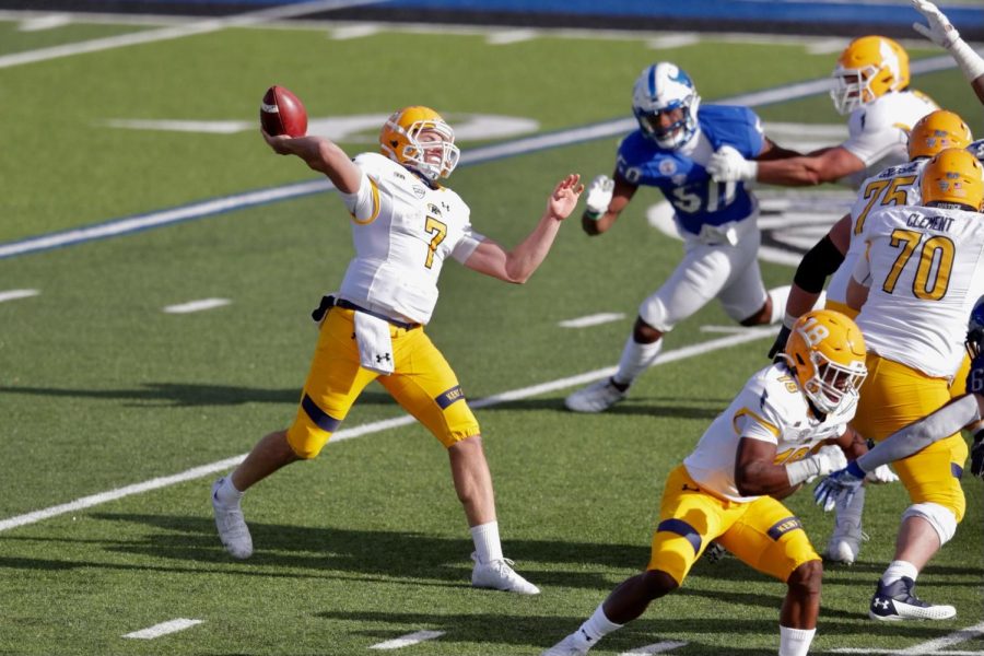 Dustin Crum (7) lets a a pass go against Buffalo. Crum would throw for 343 yards and three touchdowns. Nov. 28, 2020.