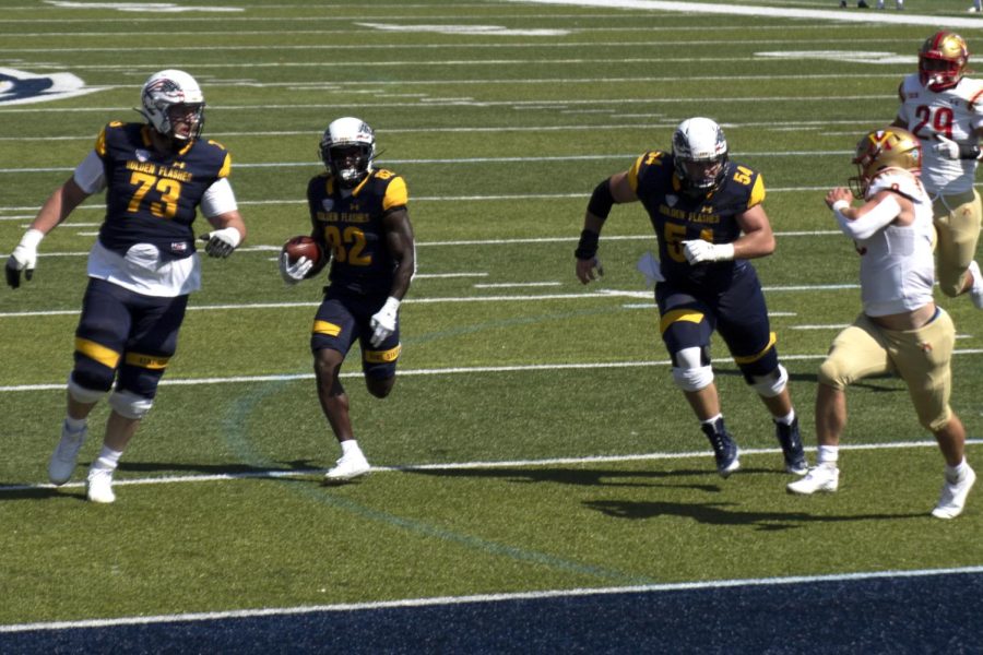 Graduate student Nykeim Johnson (82) runs into the end zone to score a touch down during the football game against Virginia Military Institute. Kent State won 60-10.
