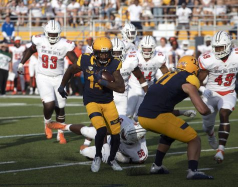 Redshirt sophomore wide receiver Dante Cephas, number 14, runs with the football during the homecoming football game against Bowling Green State University on Oct. 2, 2021. The Golden Flashes beat Bowling Green 27-20.