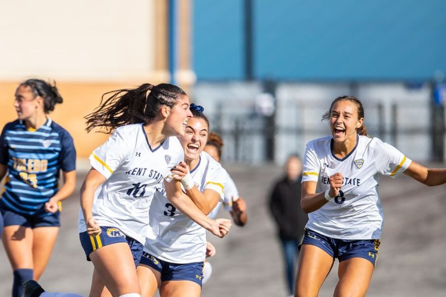 Members of the Kent State soccer team celebrate during their win against Toledo in the MAC Quarterfinals on Sunday Oct. 31 in Kent, Ohio. 