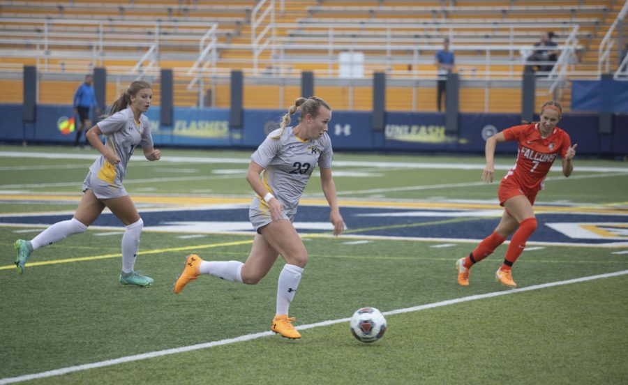 Redshirt senior defender Karly Hellstrom, number 23, dribbles the ball down the field during the womens soccer game against Bowling Green State University Oct. 3, 2021.