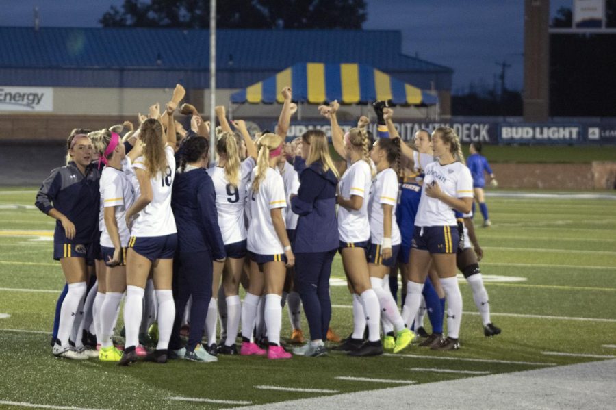 The Kent State Womens Soccer team joins in a hype chant before the game against Northern Illinois University on Oct. 7. Kent State Flashes won 2-0.