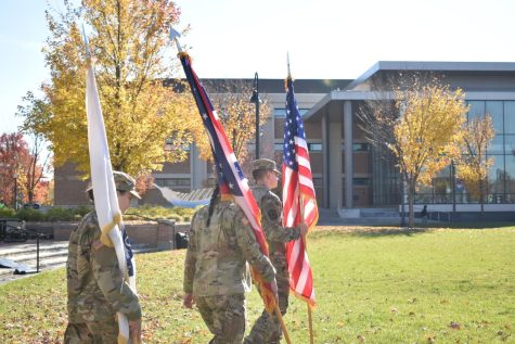 Kent State Army ROTC cadets carry flags to be raised during the Veterans Day commemoration on Wed. Nov. 10, 2021.
