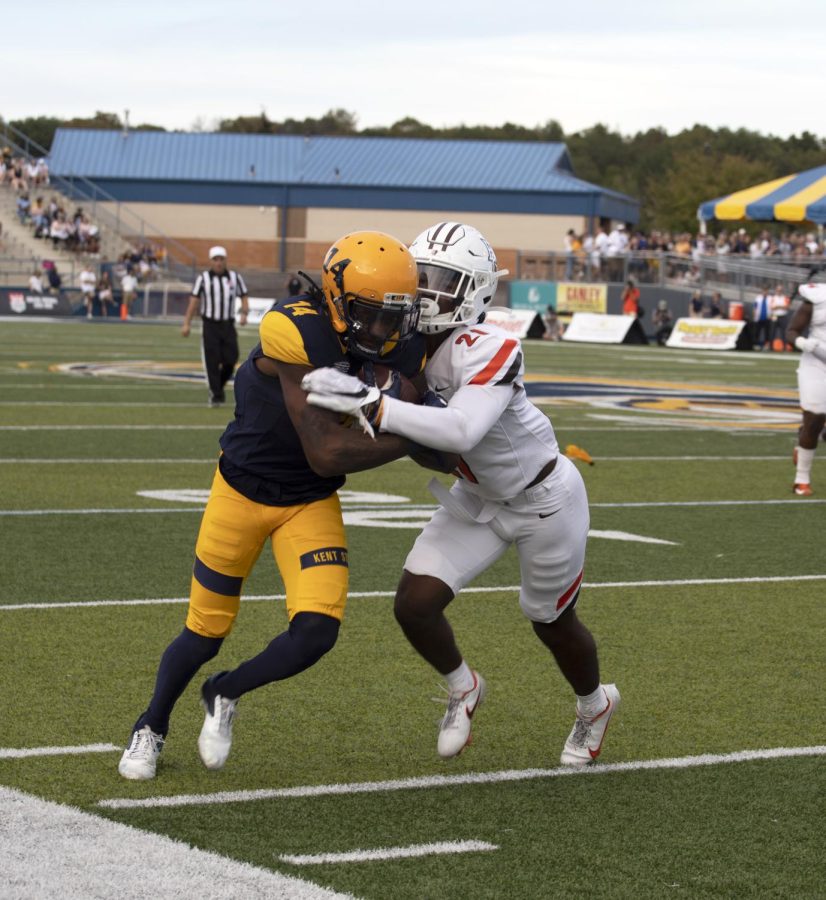 Redshirt sophomore wide receiver Dante Cephas, number 14, gets pushed out of bounds by a Bowling Green State University player during the football game on Oct. 2, 2021. The Golden Flashes won 27-20 in their homecoming weekend game.