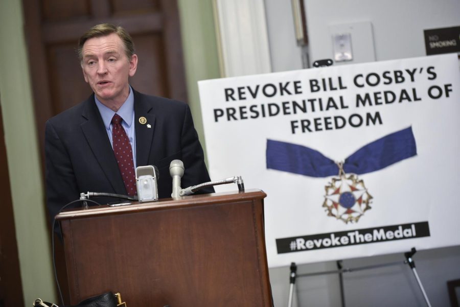 US Rep. Paul Gosar (L), R-AZ, speaks during a press conference on January 7, 2016 to announce legislation that would revoke actor Bill Cosbys Medal of Freedom on Capitol Hill in Washington, DC. The move for the legislation comes after Cosby was charged with sexual assault following a series of rape allegations. AFP PHOTO/MANDEL NGAN / AFP / MANDEL NGAN (Photo credit should read MANDEL NGAN/AFP via Getty Images)