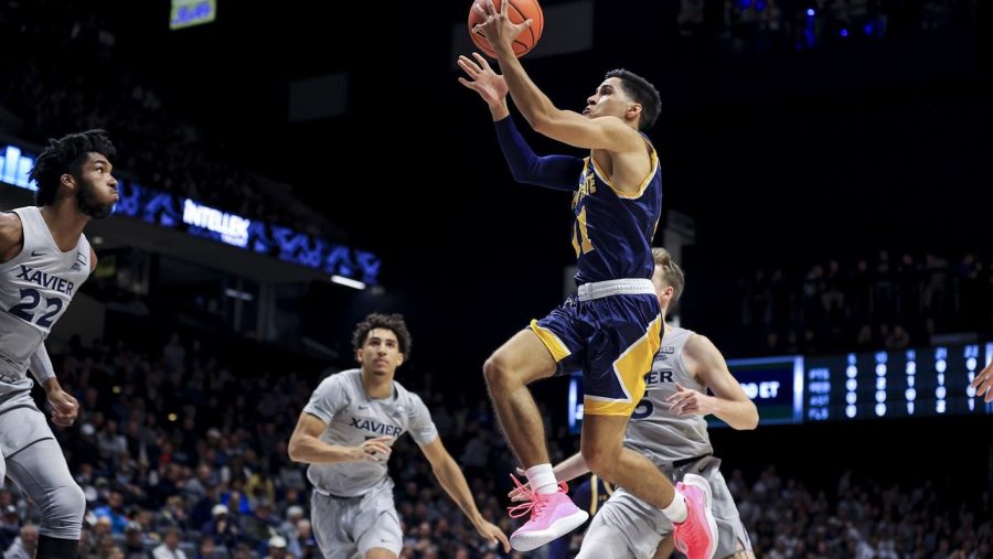 Redshirt sophomore guard Giovanni Santiago goes up for a shot during the Kent State men's basketball loss to Xavier on Friday, Nov. 12 in Cincinnati, Ohio.