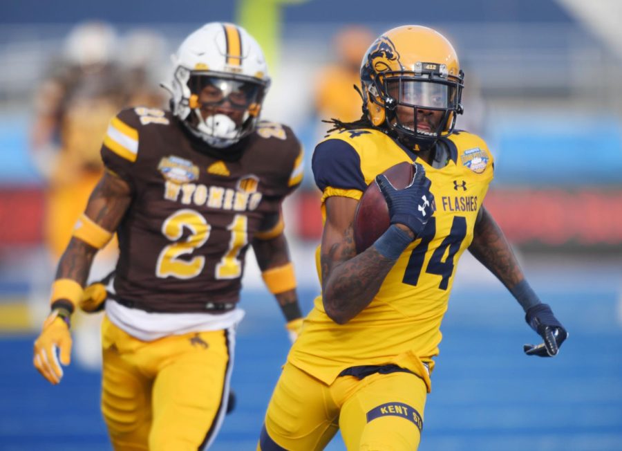 Kent State wide receiver Dante Cephas runs toward the end zone for a touchdown after catching a Dustin Crum pass in the first quarter of the Famous Idaho Potato Bowl game in Boise, Idaho on Dec. 21, 2021. The 80-yard play tied the score at 7-7. Kent State lost to the University of Wyoming Cowboys 52-38. Photo by Bob Christy/ Courtesy of Kent State University