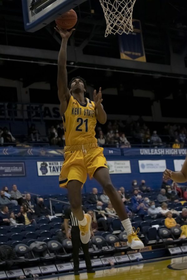 Redshirt senior forward Justyn Hamilton (21) goes for a slam dunk during the mens basketball game against Point Park University on Nov. 30, 2021. Kent State beat Point Park 107-41.