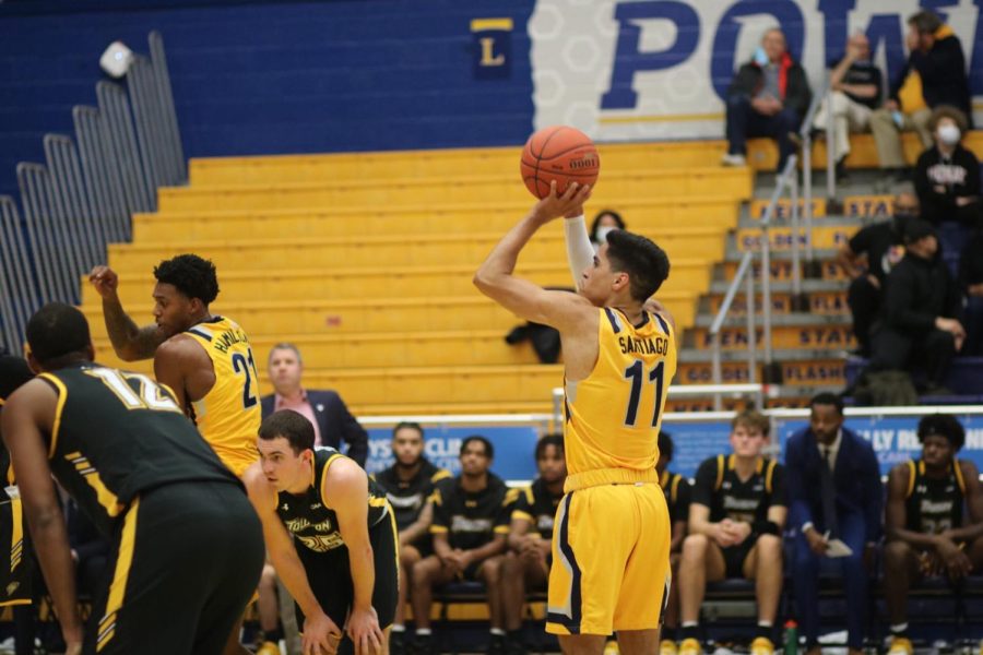 Giovanni Santiago (Guard), 11, shoots a foul shot against the Towson Tigers on Monday, Dec. 6 at Kent State. Photo by Morgan McGrath.