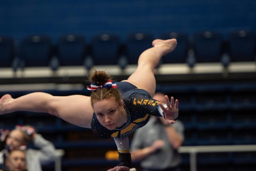 Rachel+DeCavitch+gracefully+ascends+the+balance+beam+to+start+off+her+routine+during+the+gymnastics+meet+against+Rutgers+and+Cornell+University+on+Jan.+28%2C+2022.