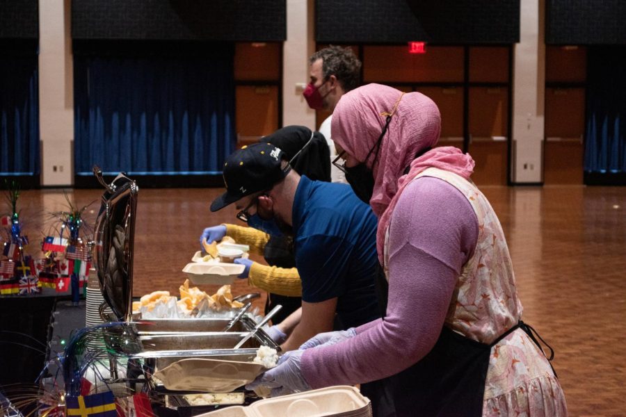 The Indonesian team serves up food during the International Cook-off on Feb. 16, 2022.