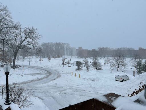 Plow tracks between Eastway and the MACC covered with fresh snow during the campus closure on Thursday, Feb. 3, 2022.