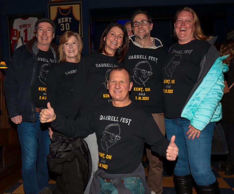 A group of friends celebrate their own festival, The Darrell Fest, when their friend Darrell is visiting from North Carolina at the BeatleFest music festival in downtown Kent on Friday, Feb. 18. They keep this tradition each time Darrell visits, and this year it aligned with the Beatle Fest.