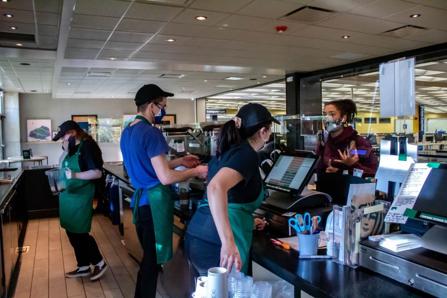Student workers work at the Starbucks located in Kent State Universitys Library. Feb. 26, 2022.