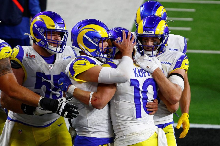 Los Angeles Rams wide receiver Cooper Kupp is embraced by quarterback Matthew Stafford after a touchdown in the fourth quarte