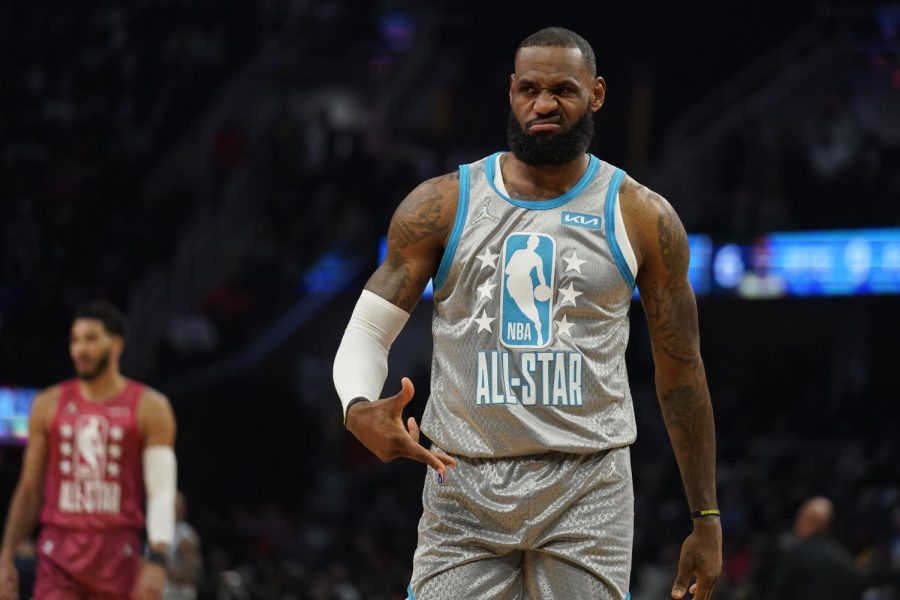 Los Angeles Lakers' LeBron James reacts to celebrities in the front row as he plays in the first half of the NBA All-Star basketball game, Sunday, Feb. 20, 2022, in Cleveland. (AP Photo/Charles Krupa)