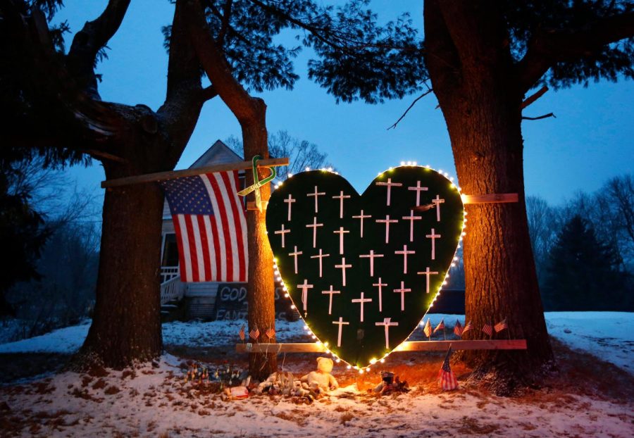 FILE+-+In+this+Dec.+14%2C+2013%2C+file+photo%2C+a+makeshift+memorial+with+crosses+for+the+victims+of+the+Sandy+Hook+Elementary+School+shooting+massacre+stands+outside+a+home+on+the+first+anniversary+of+the+tragedy+in+Newtown%2C+Conn.+%28AP+Photo%2FRobert+F.+Bukaty%2C+File%29