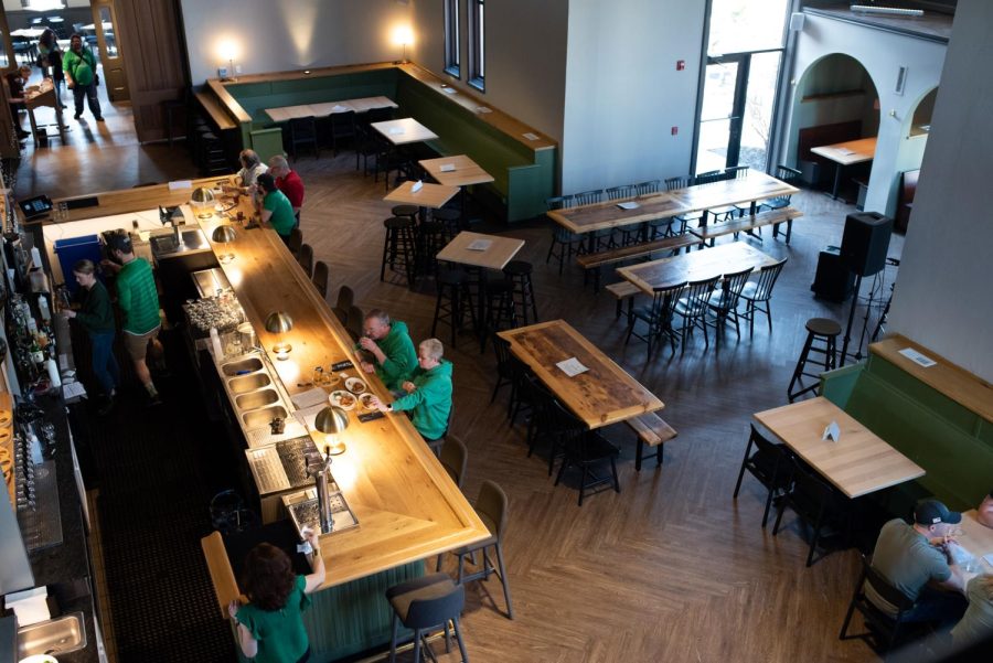 Customers order drinks and dinner at Bell Tower Brewing Co. on St. Patricks Day.